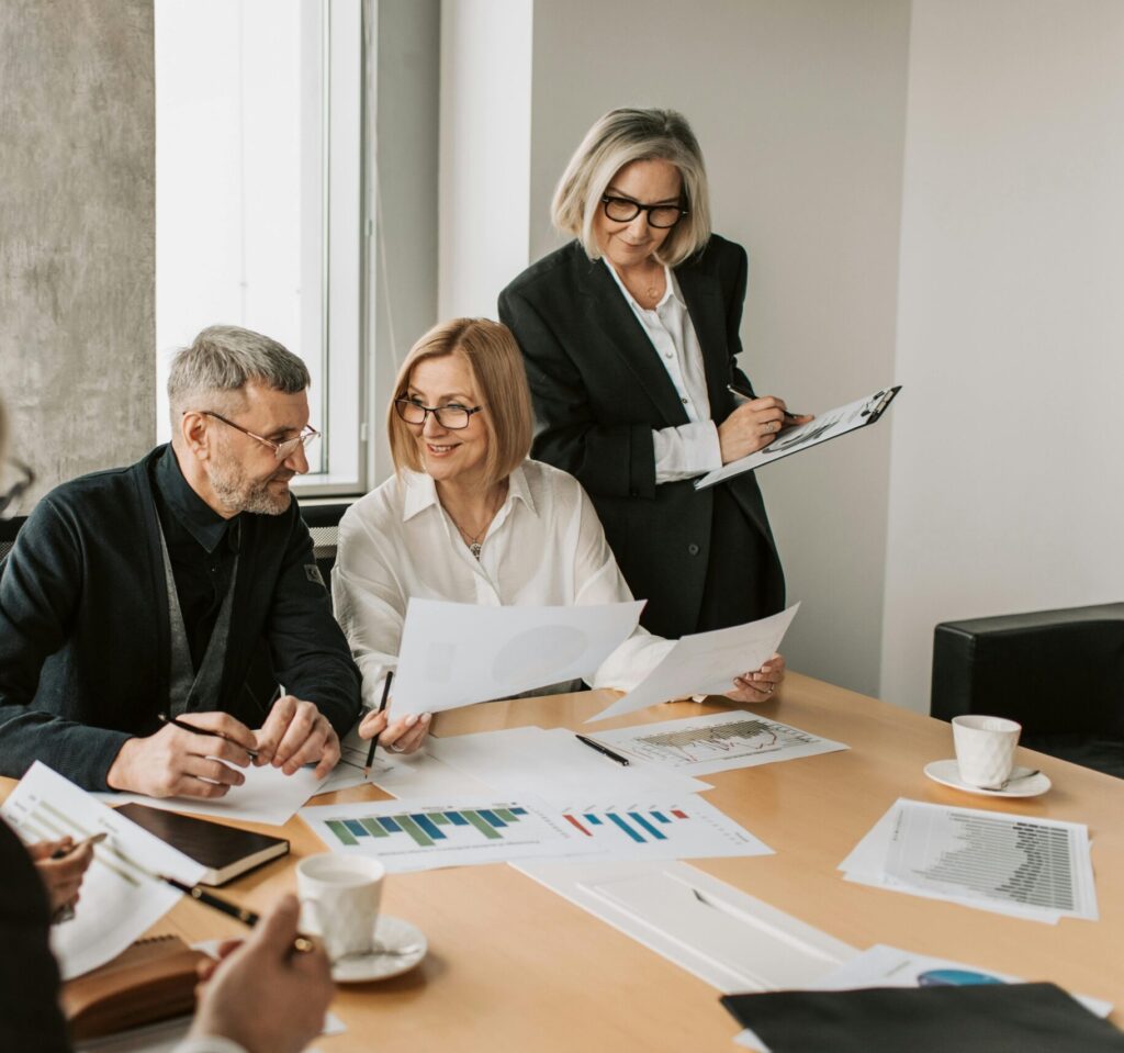 A diverse group of business professionals engaged in a strategic meeting.